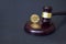 Crypto currency law theme, gavel and bitcoin symbol on brown table with copyspace.