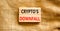 Crypto downfall symbol. Concept words Cryptos downfall on wooden blocks. Beautiful canvas table canvas background. Business and