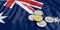 Cryptocurrency in Australia. Golden bitcoin and variety of silver virtual coins on Australia flag background. 3d illustration