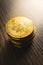 Cryptocurrency. Bitcoin virtual money. Golden coin on wooden table