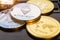 Cryptocurrency coins - Ethereum, Bitcoin, Litecoin, Ripple cryptocurrency concept stock of physical bitcoins gold and silver coins