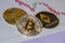 Cryptocurrency coins over trading graphic japanese candles; Bitcoin, Ethereum and Ripple coins