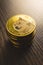 Cryptocurrency. Dogecoin virtual money. Golden coin on wooden table