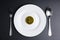 Cryptocurrency golden bitcoins coin in white dish on black backg