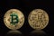 Cryptocurrency physical colored bitcoin coins. Bit coin with green logo.