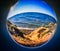 Crystal ball globe reflection of Pacific Ocean California coastline
