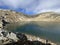 A crystal clear alpine lakes Laghi d`Orsirora during a beautiful autumn day in the mountainous area of the St. Gotthard Pass