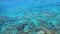 Crystal clear blue sea surface with stone bottom, sea background, water texture