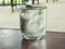 A crystal-clear glass brimming with pure, invigorating water beckons, its surface adorned with a handful of gleaming ice cubes, as