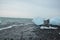 Crystal clear ice chunks on the black sand of Diamond beach in Fellsfjara, Jokulsarlon on Iceland