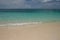 Crystal clear waters and pinkish sands on Seven Mile beach on Cayman Island