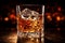 Crystal clear whiskey glass with glistening ice cubes, showcasing luxurious amber hue