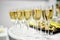 Crystal clear wine glasses with chilled expensive champagne stand on a table