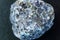 Crystal of cordierite iolite gem stone cutout, raw mineral, black background