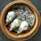 Crystal dumplings Served In A Traditional Steaming Basket. It's a famous dish of China & Hongkong.