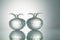 Crystal fruits with reflection on white illuminated background