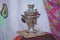 Crystal glass of tea on with metal samovar . Azerbaijan tea samovar Concept traditional Azerbaijan culture object samovar