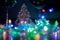 crystal glowing Christmas tree surrounded by shining garland in dark. concept new year and christmas