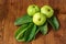 Crystal Guava fruit with leaves isolated on the wooden background