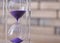 Crystal hourglass on blurred background. Time management concept