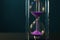 Crystal hourglass on color background. Time management concept
