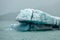 Crystal iceberg in front of Columbia glacier under the clouds