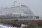 Crystal Serenity ship docked in a snowstorm