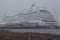 Crystal Serenity ship docked in a snowstorm