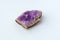 Crystal stone is a mineral. Purple rough amethyst quartz crystals, white background