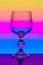 Crystal wine glass on a background of colored gradient