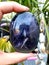 Crystal in Woman Hand : Rainbow Fluorite Gems Uncut Raw  Stones Gems Pink Nails Purple Lila Stone in Nature Gemstones Colors Ring