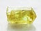 Crystal of yellow Apatite gemstone on white