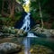 Crystalclear waterfall descends gracefully amidst tranquil woodland