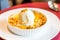 CrÃ¨me Brulee with vanilla ice cream and crushed nuts