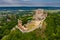 Csesznek, Hungary - Aerial panoramic view of the hilltop Castle of Csesznek and Csesznek city at sunset on a summer afternoo