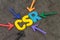 CSR, Corporate social responsibility concept, multi color arrows pointing to the abbreviation CSR at the center of black cement