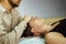 a CST treatment session for a woman, Osteopathic Manipulation and CranioSacral Therapy 10