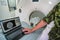 CT or computed tomography scanner inside army mobile field container ambulance, soldier showing patient with severe head