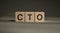 CTO word chief technology officer written in cubes on a black background