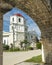 The Cuartel Ruins,and Our Lady of Conception Church,seen through an archway, Oslob,Cebu Island,The Philippines