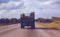 Cuba 1979, Workers travel in the back of a truck on a Cuban road