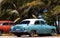 Cuba american classic cars under palms