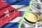 Cuba flag and cryptocurrency growing trend with two bitcoins on dollar bills