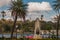 Cuba flag and statue of Jesus Christ on a hill overlooking the port and the bay of Havana.