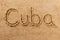 Cuba handwritten beach sand message