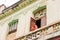 CUBA, HAVANA - MAY 5, 2017: Woman on the balcony.