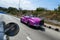 Cuba two old pink car on the road