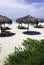 Cuban beach with umbrellas and sunbeds with Atlantic Ocean in background