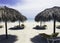 Cuban beach with umbrellas and sunbeds with Atlantic Ocean in background