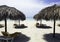 Cuban beach with umbrellas and sunbeds with Atlantic Ocean in background